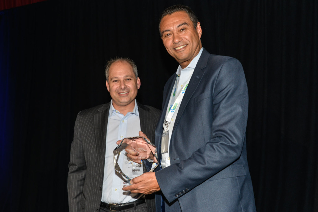 Alphonso Jenkins accepts the award for Best Connected City Deployment from JR Wilson, Chairman of the WBA, at the WBA Industry Awards.